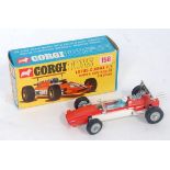 A Corgi Toys No. 158 Lotus Climax F1 racing car comprising of orange and white body with blue driver