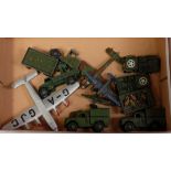 A collection of various pre- and post-war playworn Dinky Toy military diecasts, some examples have