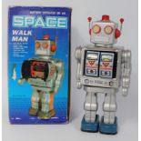 A Space Walk Man of China, silver tin plate and battery operated robot with tin printed details