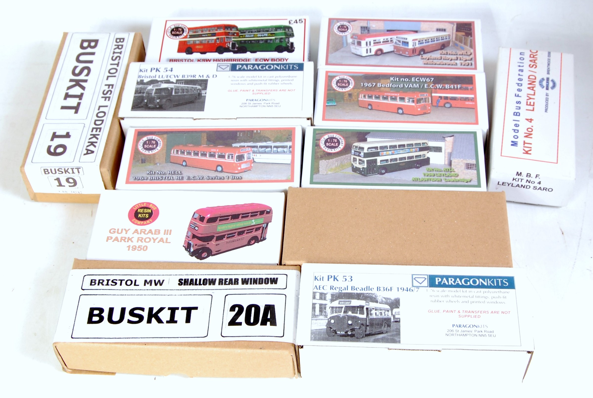 12 various boxed 1/76 scale resin and white metal public transport kits to include bus kits, Paragon