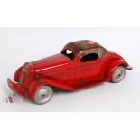 A 1930s Wolverine Manufacturing Company tinplate and friction winding drive Mystery car, finished in