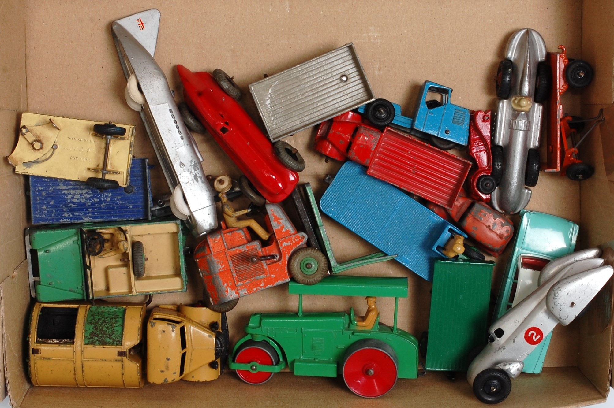 One tray containing a quantity of various playworn Dinky Toy diecasts to include a No. 143 Ford