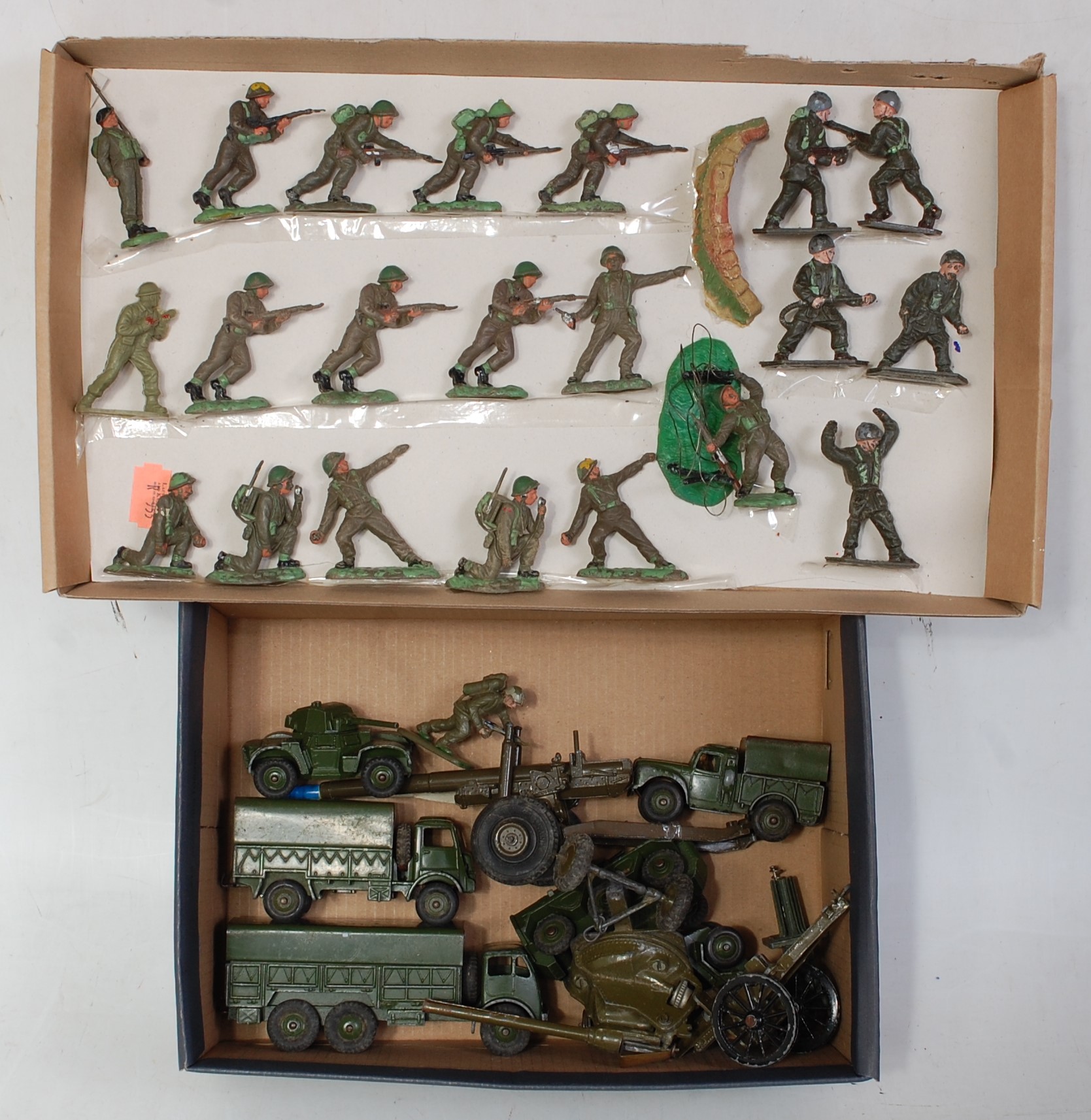 Two trays containing a mixed loose military diecast and plastic figures to include Dinky Toys,