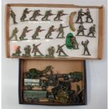 Two trays containing a mixed loose military diecast and plastic figures to include Dinky Toys,