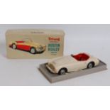 A Triang No. 100/6 1/20 scale model of an Austin Healey comprising of cream body with red interior