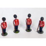 Four various Britains from set No. 111 round based Grenadier guards, some signs of overpainting, one