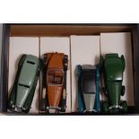 Four various boxed as issued DGM white metal vehicles to include a Riley finished in grey, black and