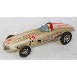 A Bandai of Japan tinplate and friction drive model of a Golden Jet racing car comprising of gold,