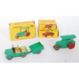 A Dinky Toys boxed agricultural diecast group to include No. 251 Aveling Barford diesel roller,