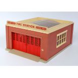 A Dinky Toys No. 954 fire station comprising of brickwork effect plastic body with cream roof and