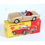 A Dinky Toys No. 114 Triumph Spitfire comprising gold body with red interior and driver figure,