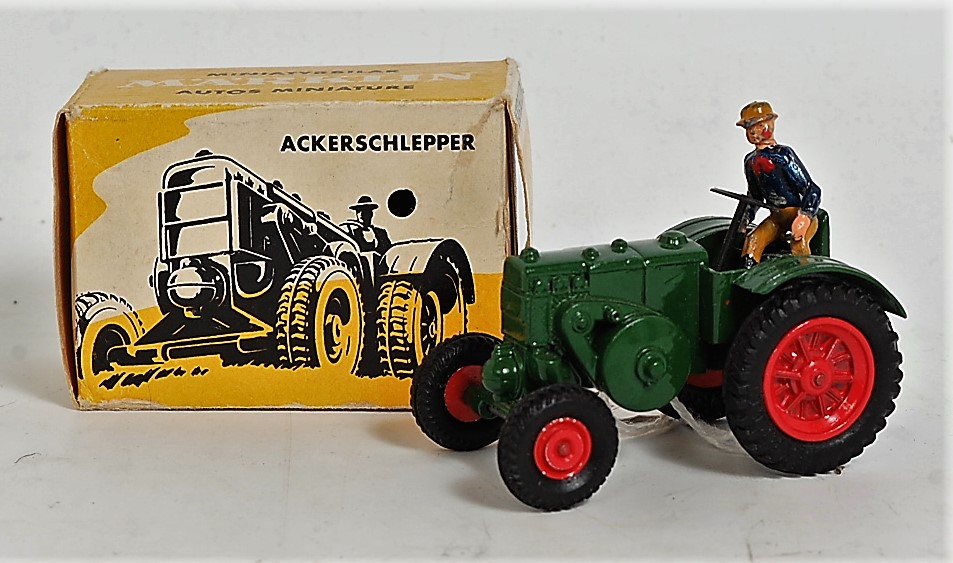 A Marklin No. 8029 Lanz agricultural tractor, finished in green with red hubs and driver figure