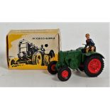 A Marklin No. 8029 Lanz agricultural tractor, finished in green with red hubs and driver figure