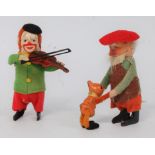 Two Schuco tinplate and soft covered clockwork musicians and figures to include gentleman swinging