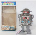 A Yoneya tin plate and plastic Model No. 2121 Captain Robot, finished with a tin plate silver and