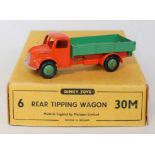 A Dinky Toys No. 30M trade box of six rear tipping wagons containing one example comprising orange