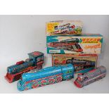 Three various boxed Japanese friction powered and battery operated tin plate locomotives to