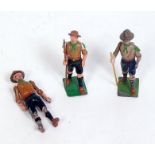 Three various loose Britains boy scout figures to include boy scout standing with axe, two walking