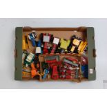 Two trays containing a quantity of various playworn Britains Dinky Toy and Corgi Toy diecasts, to