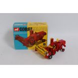 A Corgi Toys No. 1111 Massey Ferguson 780 combine harvester comprising of dark red body with