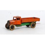 A Dinky Toys pre-war No. 25A four wheel wagon comprising of orange body with green chassis and black