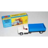 A Corgi Toys No. 483 Dodge Kew Fargo tipper comprising of white cab with metallic grey chassis and