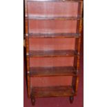 A 19th century mahogany waterfall freestanding open bookshelf, raised on turned supports, width