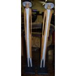 A pair of painted softwood Far Eastern standing figures of elongated form, height 100cm