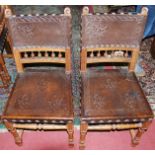 A set of eight circa 1900 French walnut embossed leather and further studded dining chairs