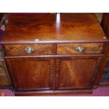 A 19th century mahogany and flame mahogany double door side cupboard, having twin frieze drawers,