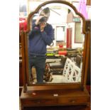 An early 20th century Queen Anne style mahogany arch shaped top bevelled swing dressing table mirror