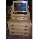 An Edwardian pine swing mirrorback dressing chest of three long drawers, w.90cm