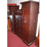 A Victorian scrumble finish pine gentleman's wardrobe, the central compartment fitted with five long