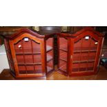 A pair of reproduction single door glazed hanging dome topped wall cabinets, width 56cm