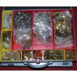 Two metal suitcases containing a quantity of mainly brass Meccano components, to include cogs,