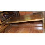 A contemporary hardwood plank top effect low coffee table, length 126cm