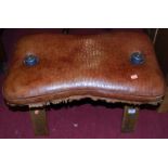 A beech framed and tan leather cushion upholstered camel stool, width 60cm