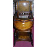 An Edwardian stained walnut child's high chair having tan leather studded pad back; together with an