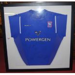 A framed Ipswich Town 1st team shirt, circa 2004, signed by the first team squad