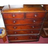 A large mid-Victorian mahogany round cornered chest of two short over four long graduated drawers to