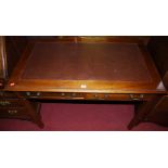 A mahogany and rexine inset two drawer writing table, width 107cm