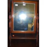 A late Victorian mahogany swing dressing table mirror, raised on ring turned and square cut A-