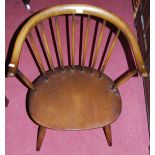 An Ercol dark elm stick back tub chair, together with a mahogany splatback panelled seat single