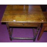 A late 18th century joined provincial elm single drawer side table, raised on turned and square