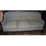 An early 20th century black lacquered and chinoiserie decorated three-seater sofa, having