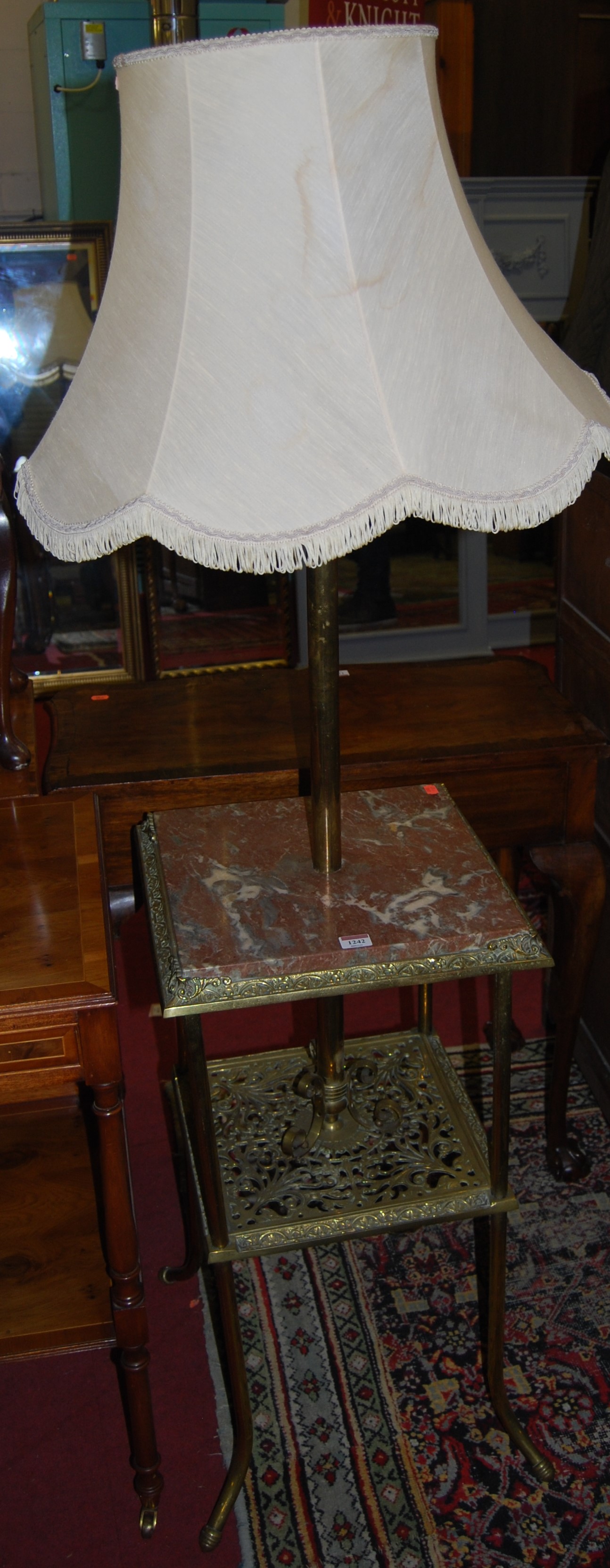 An early 20th century brass and rouge marble inset square two tier standard lamp, width 40cm