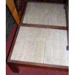 A pair of 1970s hardwood and travertine inset low rectangualr coffee tables, length 122cm