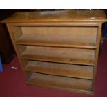 An early 20th century oak freestanding open bookshelf, having adjustable shelves, width 113cm