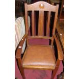 A set of five early 20th century oak slat back dining chairs, each having tan leather upholstered