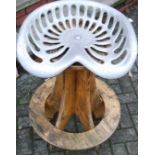 A powder coated cast aluminium and plywood bar stool